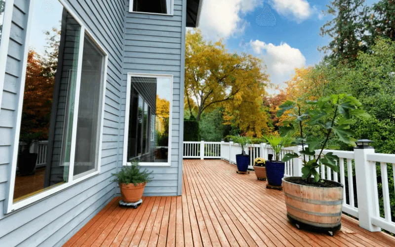 white-railing-surrounding-stained-elevated-wood-deck_result